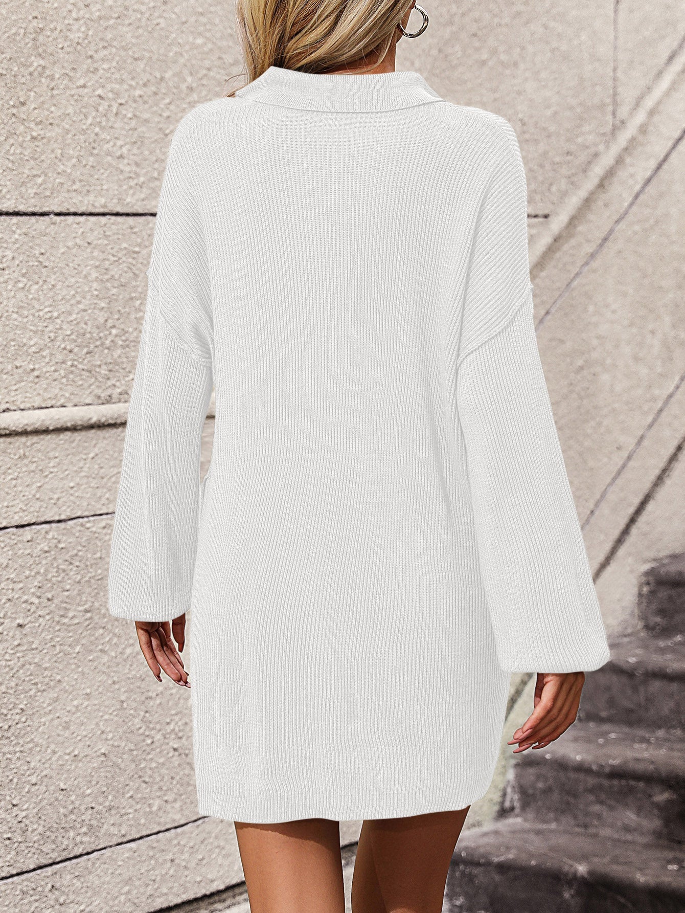 White ribbed knit polo dress with long sleeves and a collar.