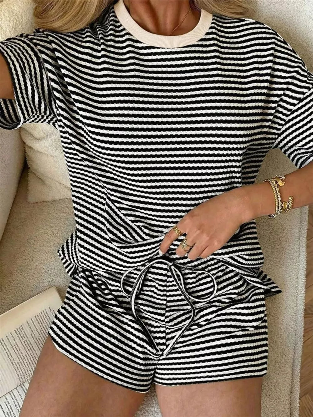 Black and white striped two-piece set with drawstring shorts and crew neck top