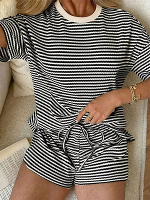 Black and white striped two-piece set with drawstring shorts and crew neck top