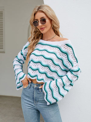 Scalloped crochet crop sweater with white and turquoise wave pattern, off-the-shoulder neckline, and bell sleeves.