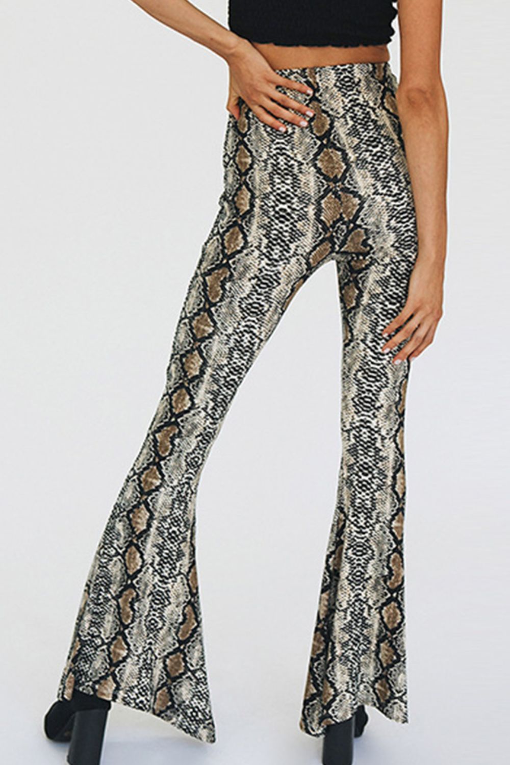 Serpentine bell-bottom pants with a snakeskin print and second-skin fit.