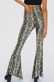 Serpentine bell-bottom pants with a snakeskin print and second-skin fit.