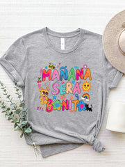 Gray graphic tee with "Mañana Sera Bonito" text and colorful cartoon illustrations.