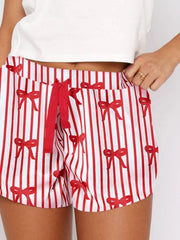 Striped lounge shorts with red bows and a drawstring waist.