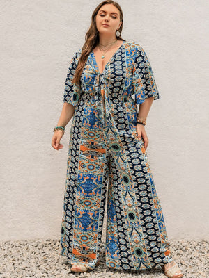 Bohemian palazzo jumpsuit in Peacock Blue with tie-front and bell sleeves.