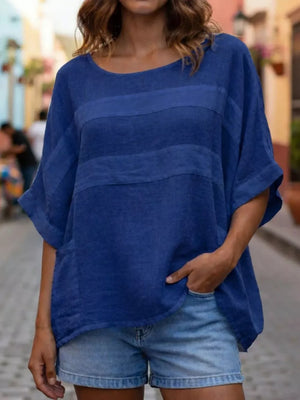 Blue striped relaxed fit blouse with short sleeves and round neck.
