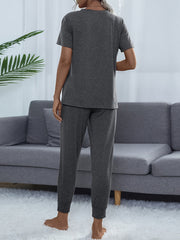 Charcoal relaxed-fit tee and jogger set with cuffed ankles.