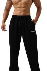 Black distressed jogger trousers with Gym Bull logo and drawstring waist.