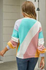 Geometric colorblock knit crewneck sweater in acrylic blend with diagonal pastel color blocking.