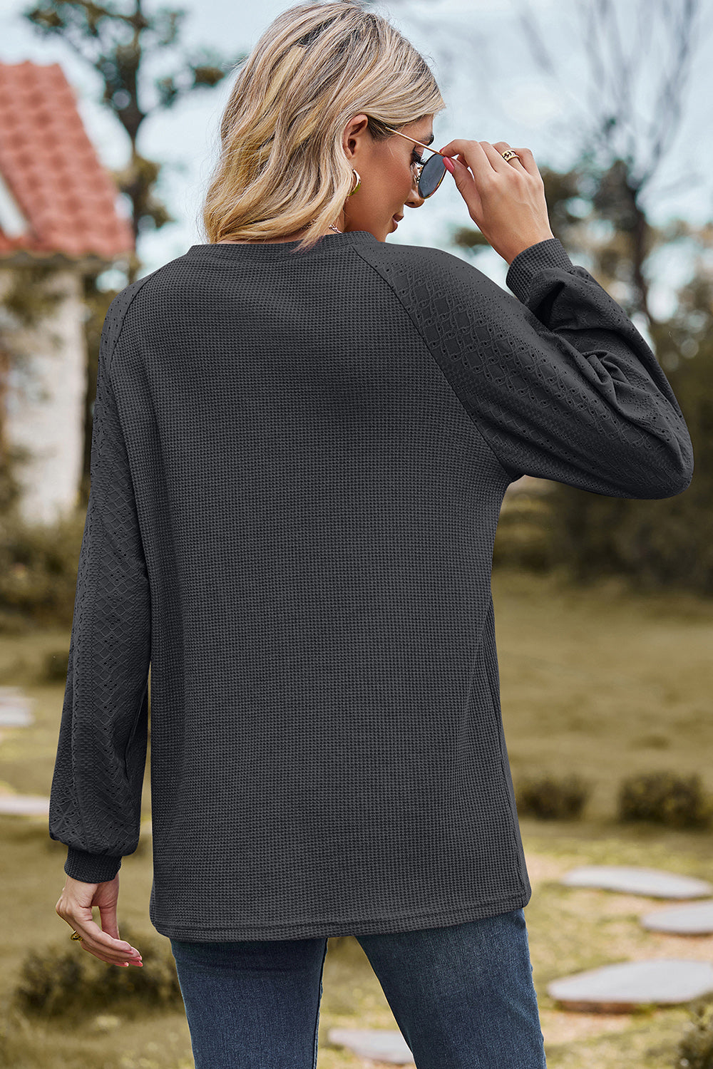 Dark Gray waffle knit raglan sleeve top with eyelet detail on sleeves.