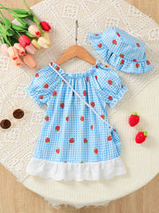 Baby dress set with blue gingham and strawberries, includes matching hat and purse.