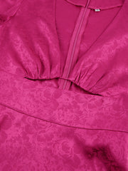Vibrant cerise mini dress with deep V-neck, cutout detail, and floral jacquard pattern.