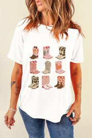 White t-shirt with a graphic print of nine different cowboy boots in various western motifs.