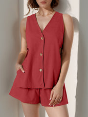Scarlet linen co-ord set with button front vest and shorts, featuring cut-out sides.