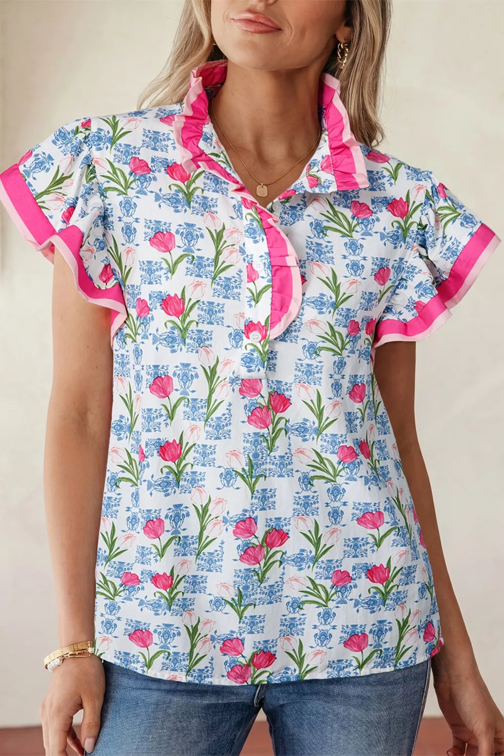 Tulip print cotton blouse with ruffled collar and short sleeves, pink trim.