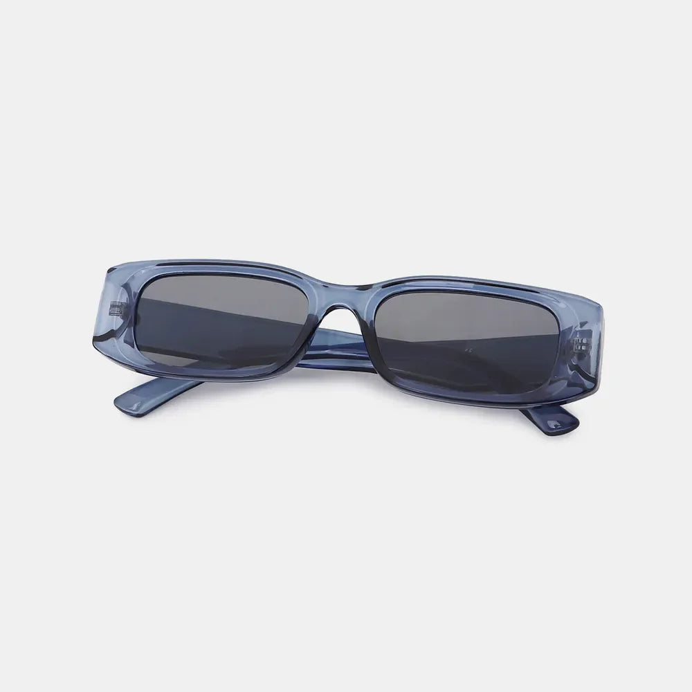 Chunky rectangular sunglasses in dusty blue with dark lenses.