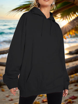 Black oversized hoodie with pouch pocket and drawstring hood, casual relaxed fit