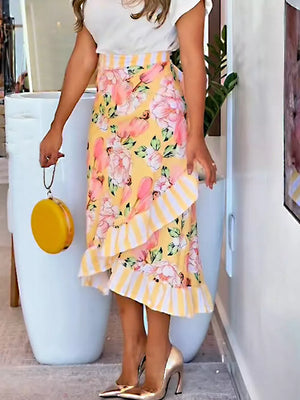 Yellow floral print skirt with ruffled hem and striped waistband.