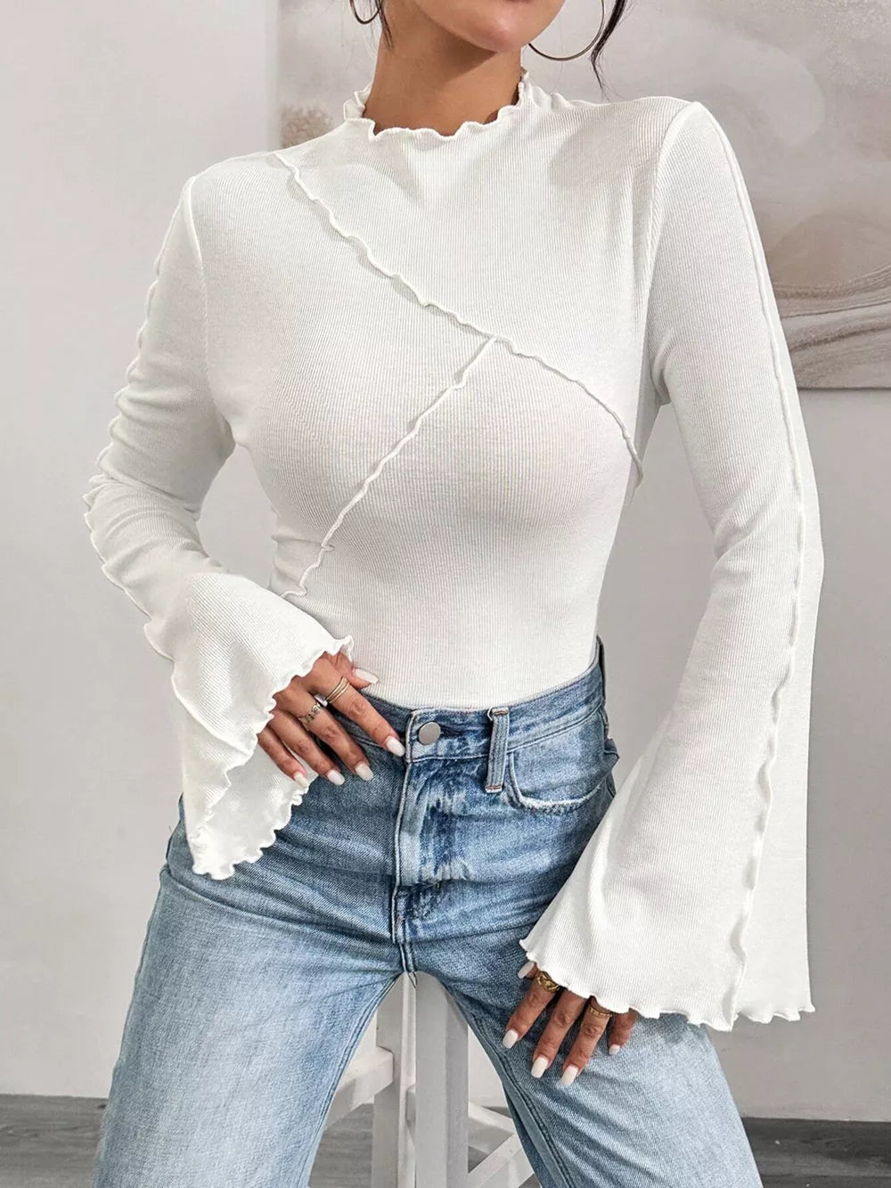 White lettuce edge flare sleeve t-shirt with seam detail and mock neck