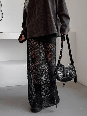 Black lace maxi skirt with sheer detail, featuring a floral pattern and floor-length cut.