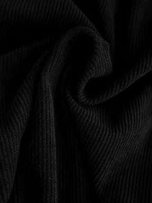 Black corduroy fabric detail showing ribbed texture.