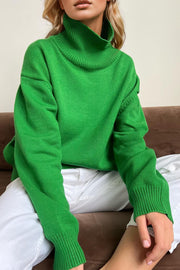 Green oversized cashmere turtleneck sweater with ribbed cuffs and collar.