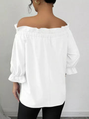 White off the shoulder blouse with ruffled neckline and bow sleeves.