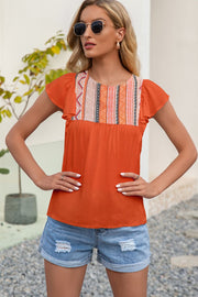 Orange blouse with embroidered yoke and ruffle sleeves