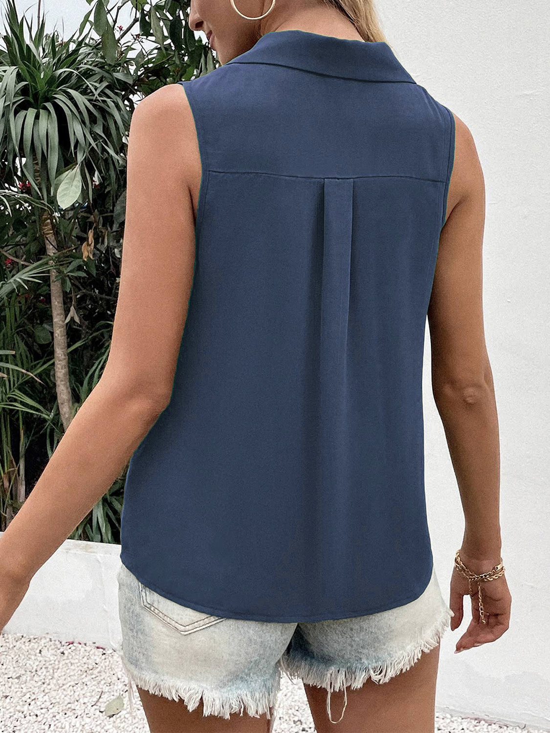 Dusty blue sleeveless collared blouse with back pleat detail