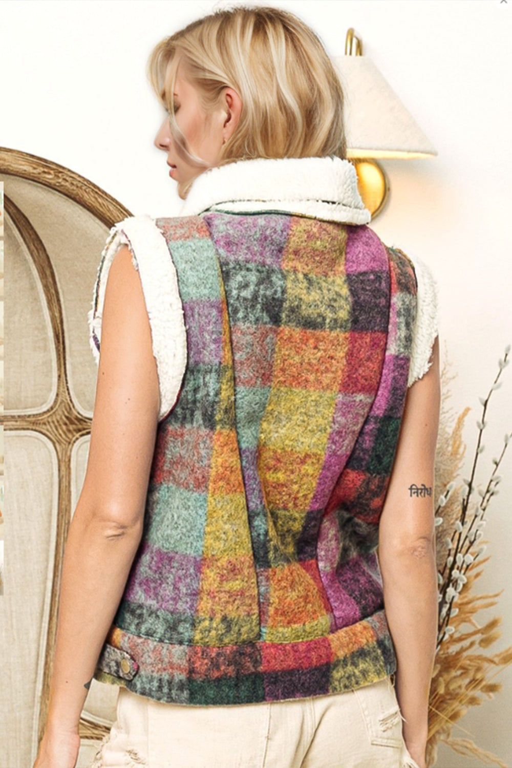 Multicolored plaid shearling collar vest with textured fabric and sherpa trim.