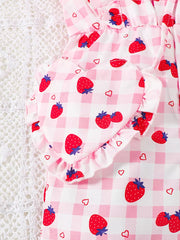 Strawberry ruffle jumpsuit with heart detail and gingham pattern.