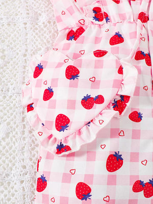 Strawberry ruffle jumpsuit with heart detail and gingham pattern.