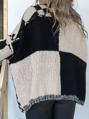 Oversized checkerboard knit cardigan in black and mocha with a relaxed fit and dropped shoulders.