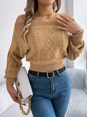 Camel cable knit off-shoulder crop sweater with diamond pattern detail.