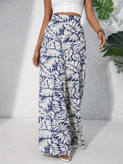 Palazzo trousers in blue with white tropical leaf print, 100% polyester, wide leg.