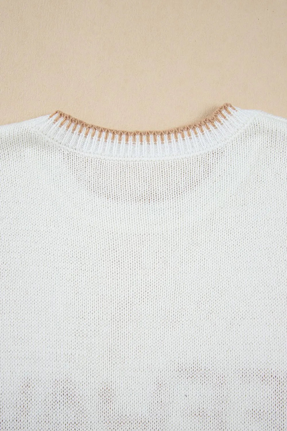 White acrylic knit sweater with contrast stitch trim neckline detail