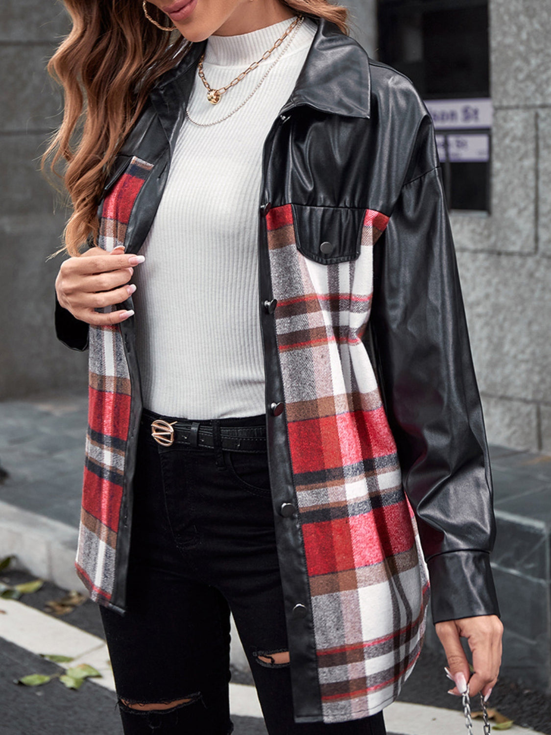 Black faux leather and plaid shacket with button-down front and chest pockets.