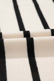 Beige and black striped knit cardigan with button-up detail.
