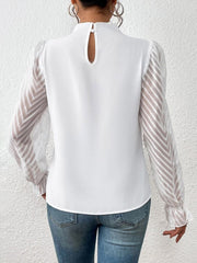 White ruffle neck blouse with sheer chevron sleeves and keyhole back detail