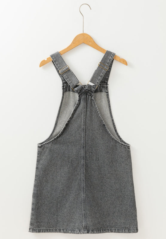 Gray faded denim pinafore dress with adjustable straps and a straight cut.