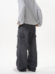 Grey cargo pants with versatile pockets and a relaxed fit.