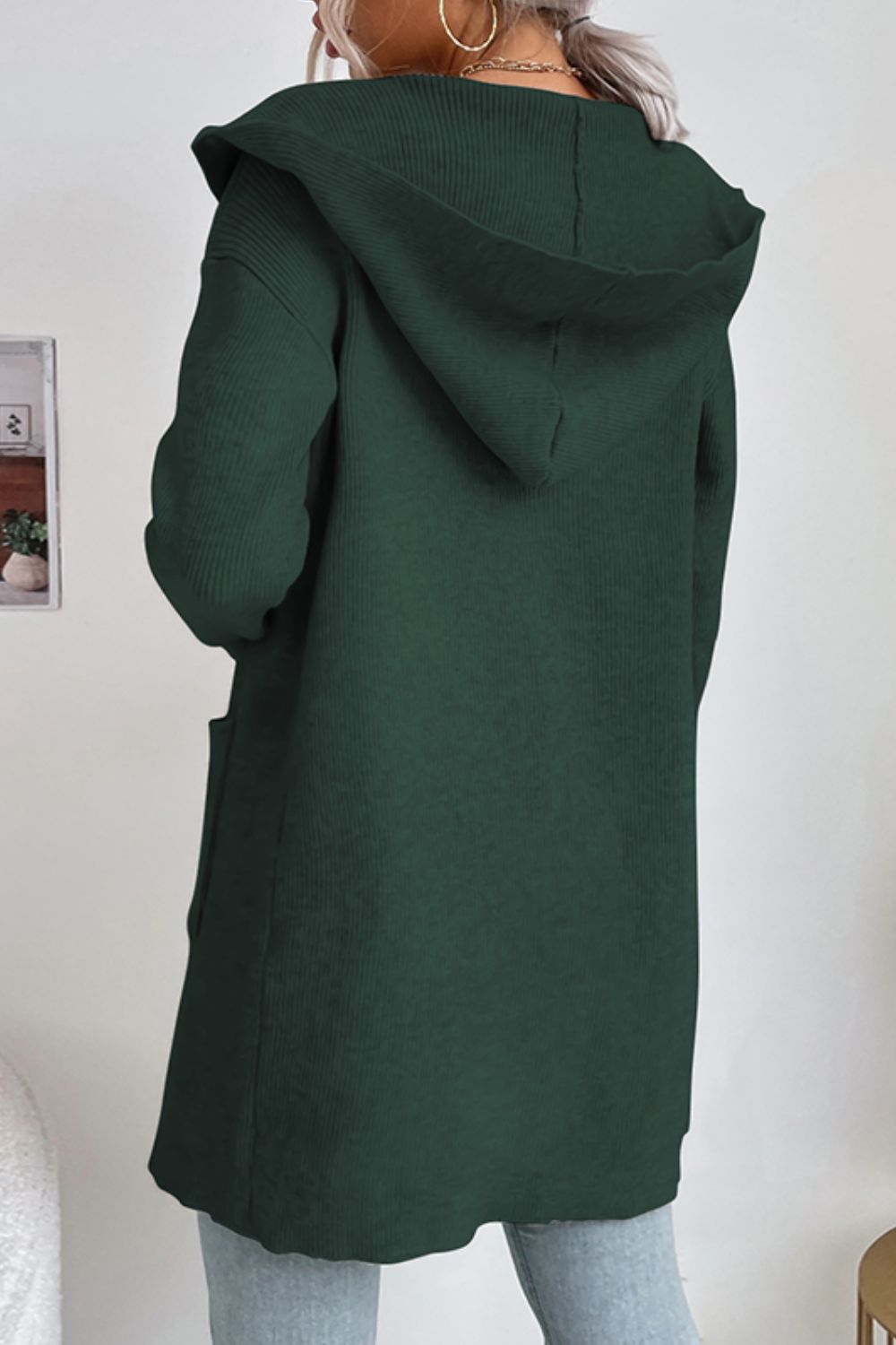 Black Forest hooded ribbed knit cardigan with pockets and drape front.