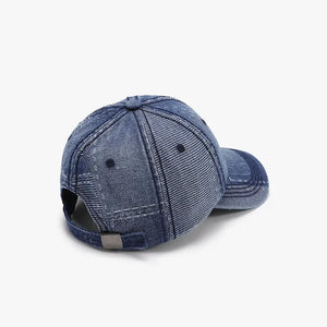 Denim patchwork baseball cap in a medium wash with visible stitching and adjustable strap.