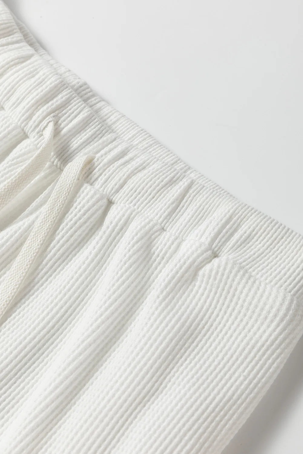 White textured ribbed lounge pants with drawstring waist