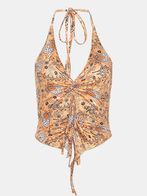 Tangerine paisley print ruched halter top with tie neck and drawstring hem.