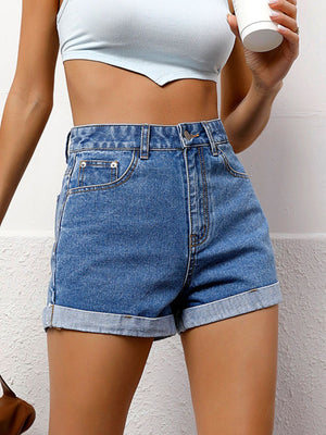Light blue denim high-waist shorts with cuffed hems and button fly.