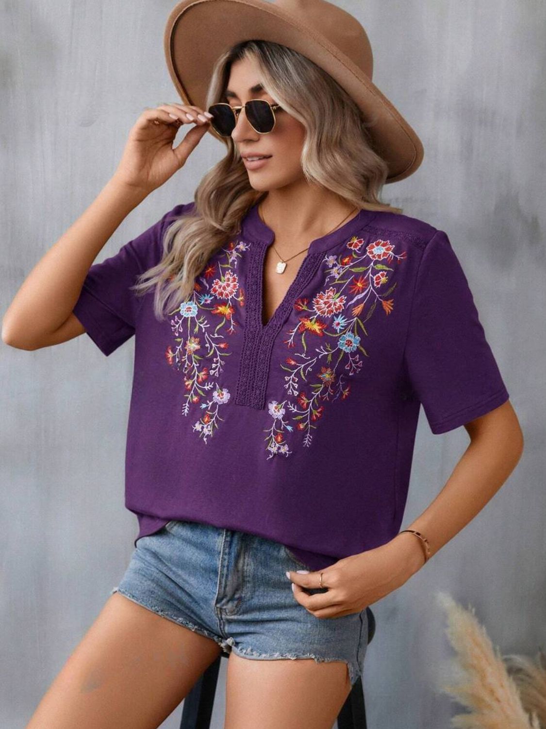 Violet V-neck tee with floral embroidery and crochet trim detail