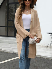 Longline tan knit button-down cardigan with hood and pockets, styled with a white tank and jeans.