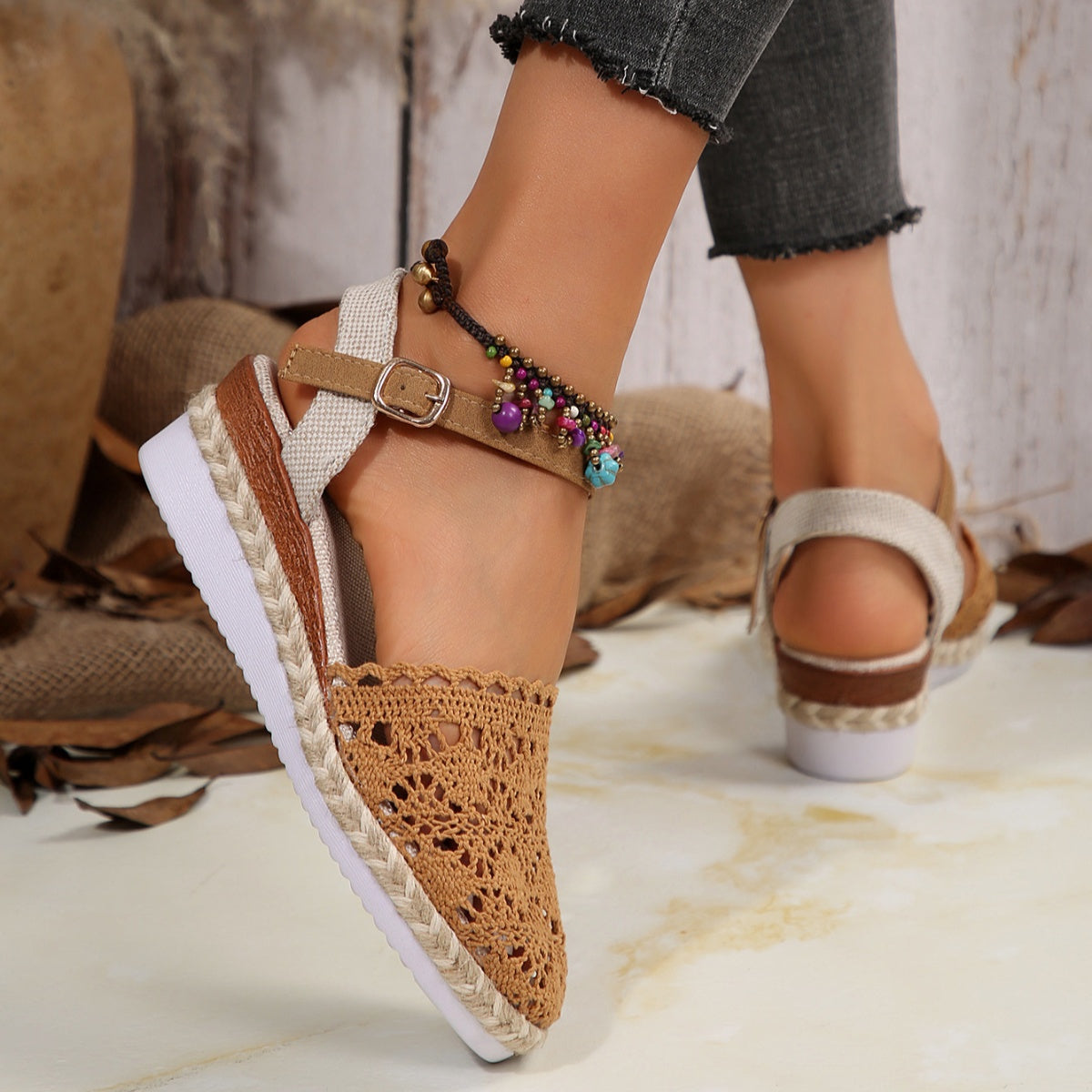 Brown crochet espadrille wedge sandals with adjustable ankle strap and beaded anklet.