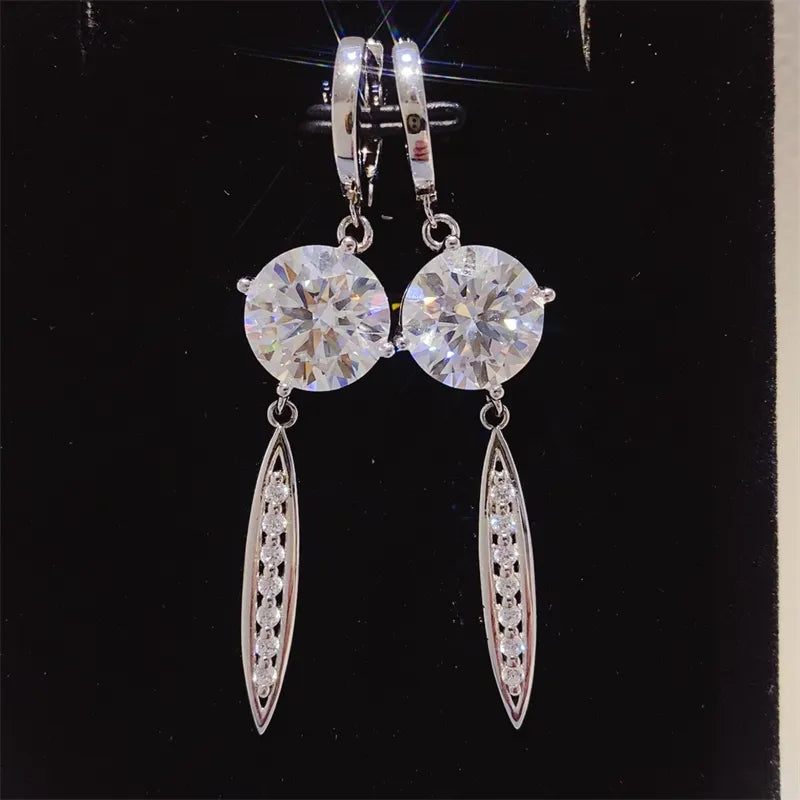Silver moissanite orb & pavé dangle earrings with lever backs.